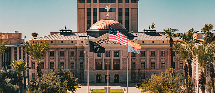 close up of a man signing a government document